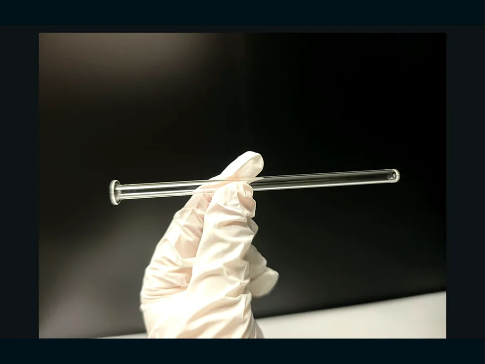 Representative WONIK precision quartz tube and handling component — front view